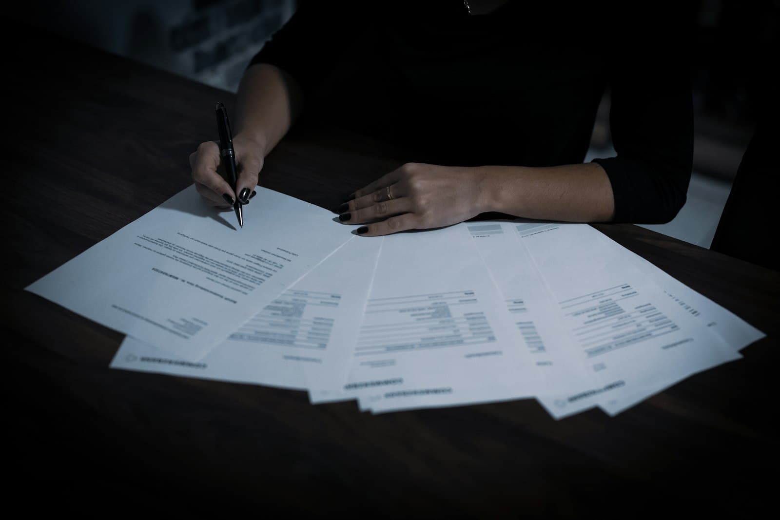 Documents spread across a table during a review