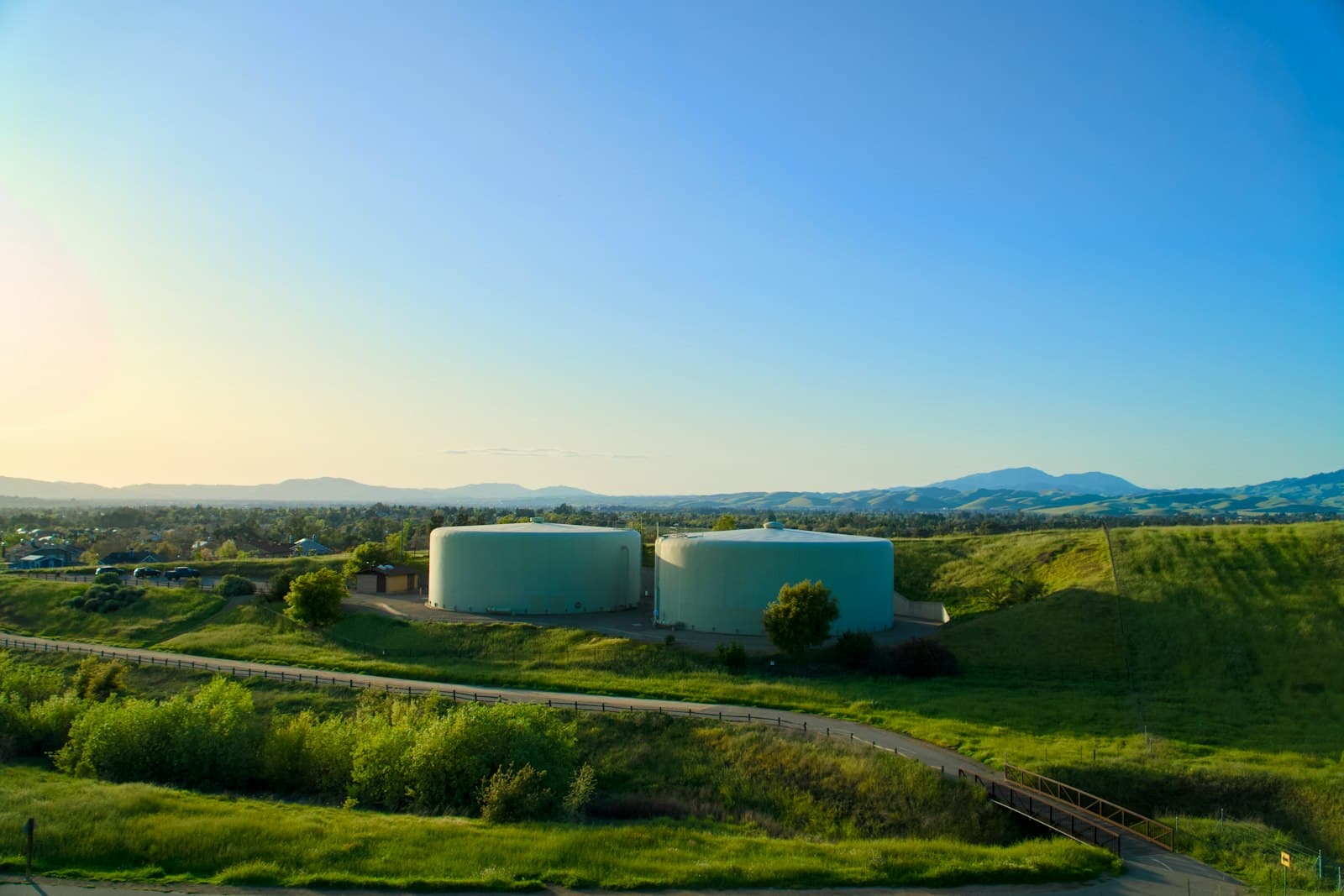 Illustrative view of storage tanks on a hillside